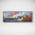 A framed panoramic landscape painting of a dramatic coastal scene with cliffs, ocean waves, and a colorful sunset sky, displayed on a light gray wall.
