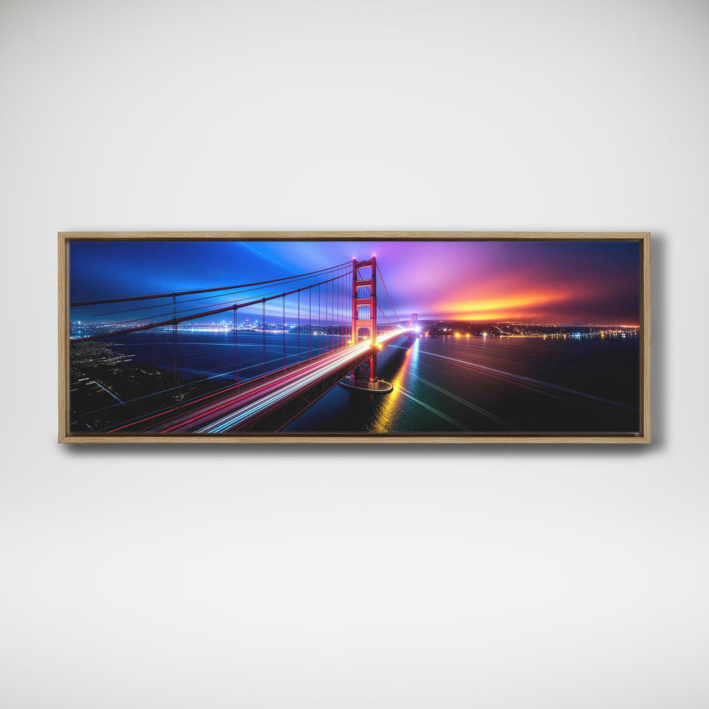 Panoramic framed image of traffic light trails across the Golden Gate Bridge beneath a blue and purple sunset sky.